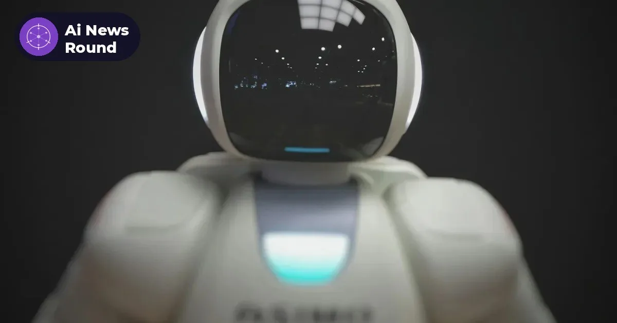 A white humanoid robot with a dark glass visor, photographed against a black background